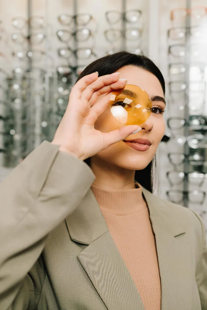 Patient examining lens at TK Optometry