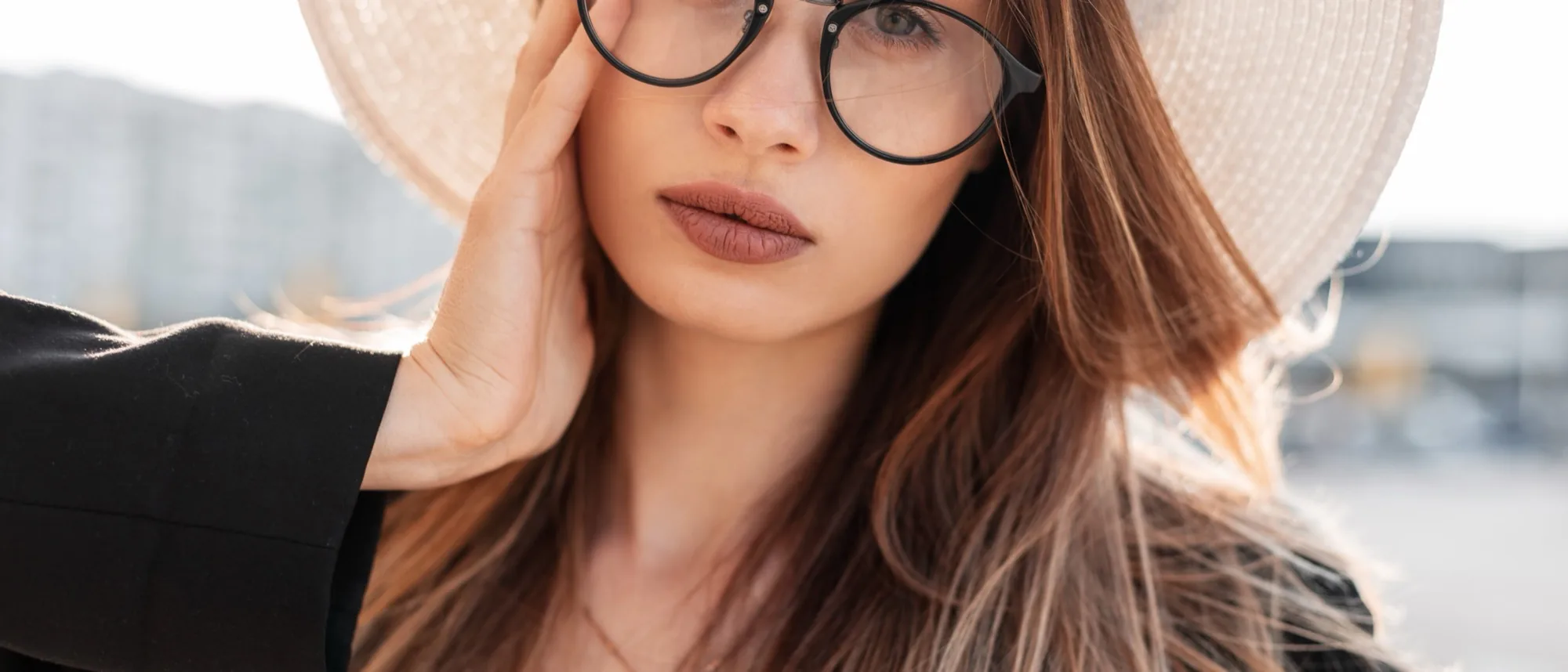 Elegant patient wearing designer eyewear at TK Optometry