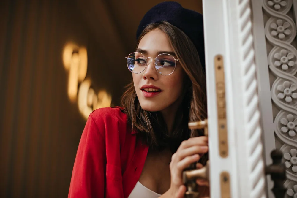 Patient wearing refined eyewear, reflecting the considered care of TK Optometry